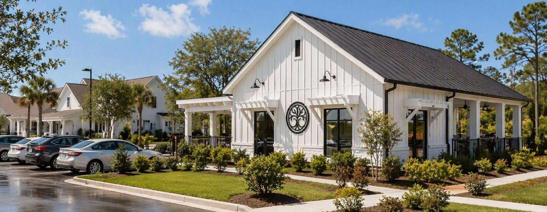 a white house with a parking lot