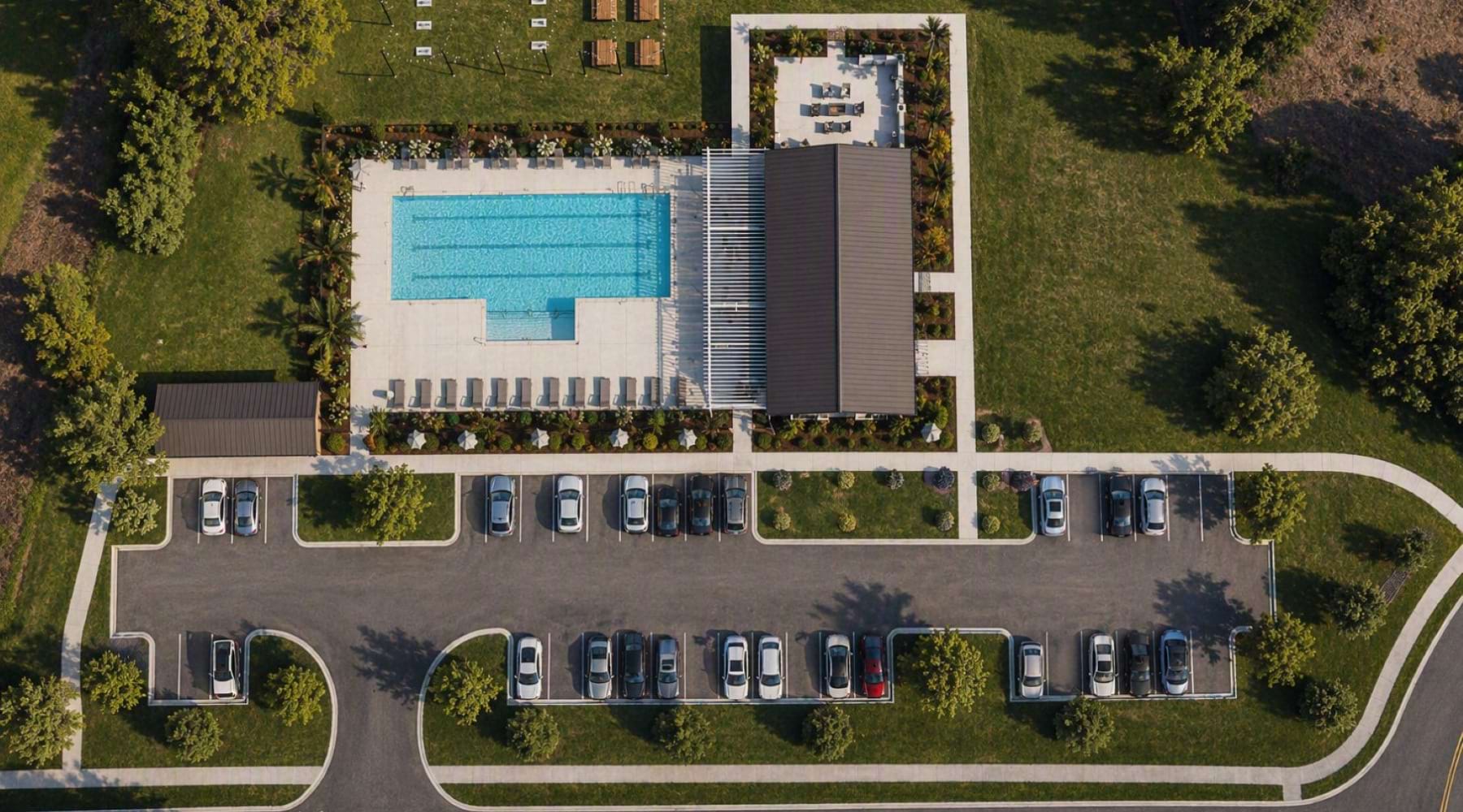 aerial view of a building parking lot and pool