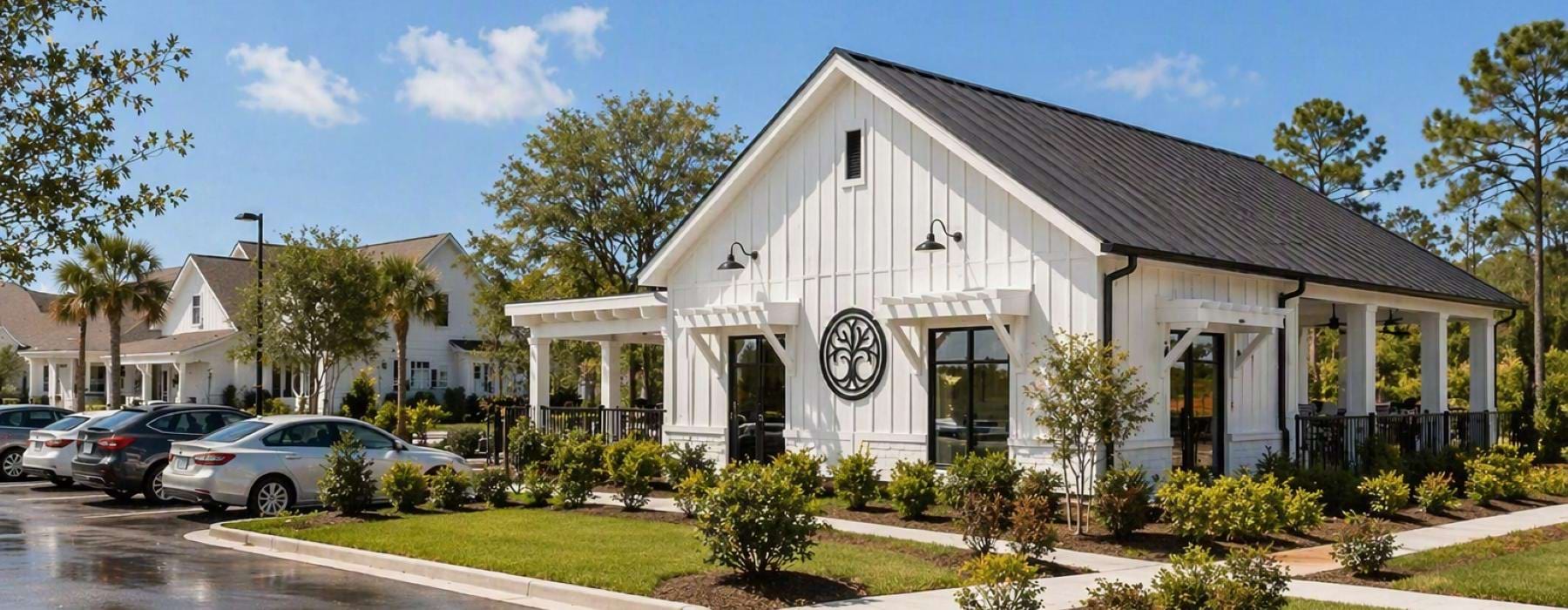 a white house with a parking lot